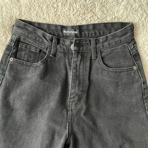 Black split hem jean